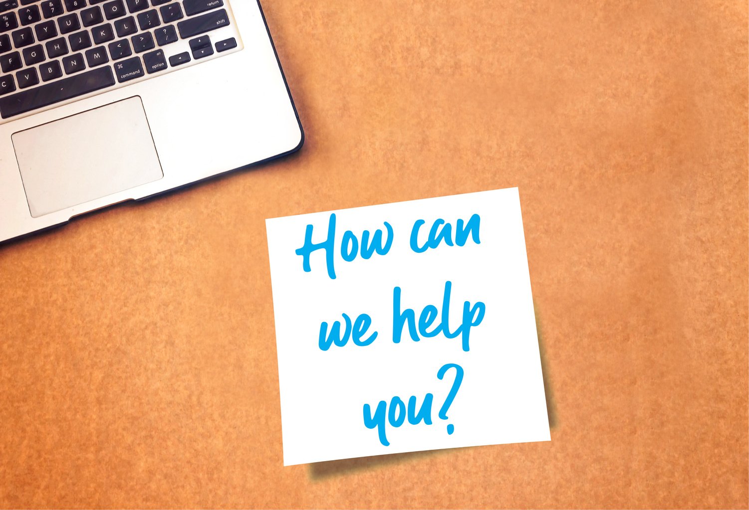 How can we help you Sign on sticky note and laptop on table